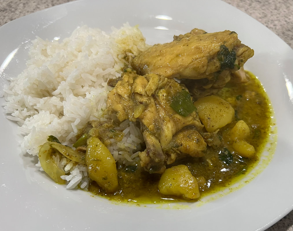 Dianne's Jamaican curry chicken with potatoes served over white rice