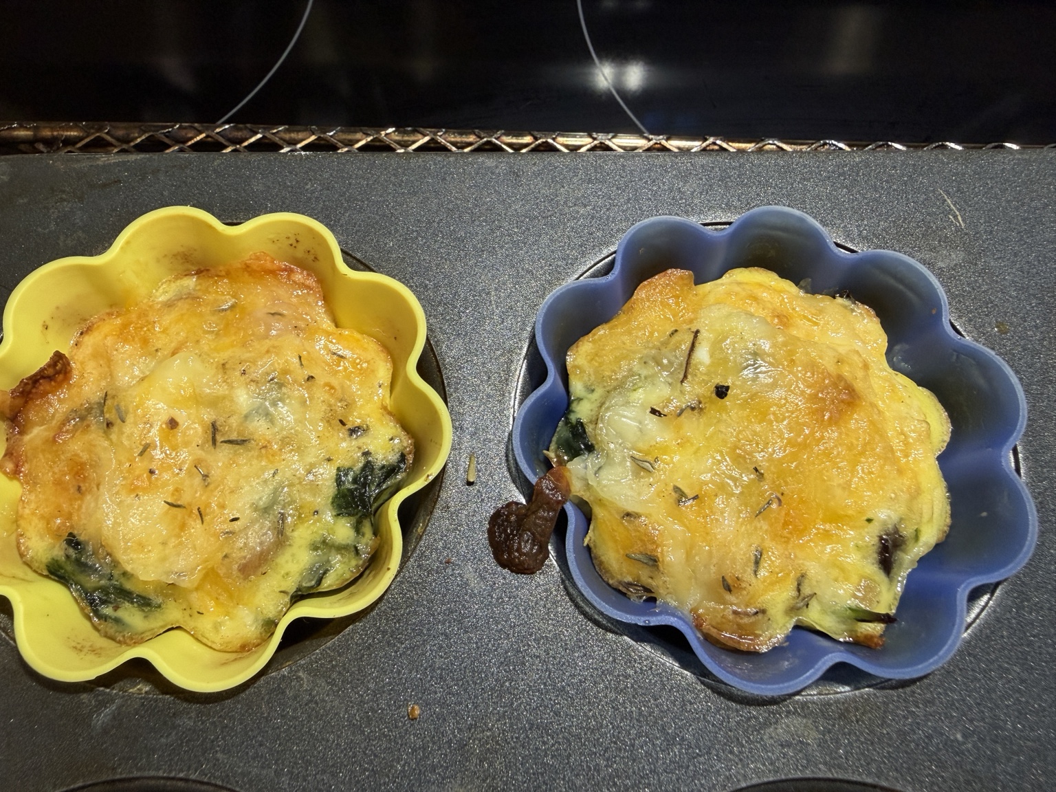 Breakfast egg bites baked in colorful flower-shaped silicone muffin cups
